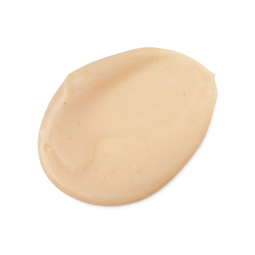 A swatch of smooth, thick, peachy beige coloured Jasmine and Henna hair treatment, with tiny brown flecks.